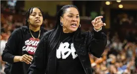 ?? MIC SMITH/ASSOCIATED PRESS ?? Coach Dawn Staley led South Carolina to its first undefeated regular season in program history, capped by a victory in the SEC Tournament this past weekend. The Gamecocks were ranked No. 1 wire-to-wire in the Associated Press poll.