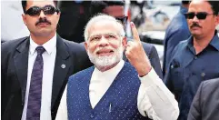  ?? PHOTO: REUTERS ?? Prime Minister Narendra Modi after casting his vote during the final phase of Gujarat Assembly election in Ahmedabad on Thursday