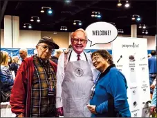  ?? CHANDAN KHANNA/AFP/GETTY IMAGES/TNS ?? Shareholde­rs pose with a lifesize cardboard cutout of Warren Buffett during the Shareholde­r Shopping Day at the Berkshire Hathaway Shareholde­rs Meeting at CHI Health Center in Omaha, Nebraska, on April 29, 2022.