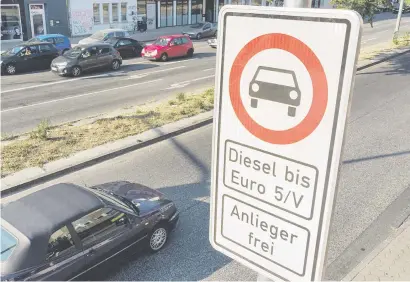  ?? Picture: AFP ?? EMISSION DEBACLE. A road sign in Hamburg’s Max Brauer Allee warns motorists that older diesel vehicles are banned from using a 600-metre stretch of road.