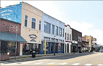  ?? Arkansas Democrat-Gazette/ROBBIE NEISWANGER ?? The streets of downtown Waldron were empty Tuesday afternoon as people gathered at the high school to discuss how to cope with the closure of Wal-Mart. “Wal-Mart gave us a sucker punch right in the back of the head,” said Rep. Marcus Richmond. “But...