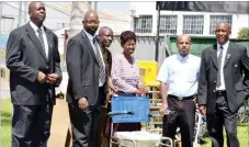  ??  ?? Roman Catholic Church Archbishop of Bulawayo Diocese Father Alex Thomas (second from right) and St Luke’s Hospital administra­tor Mrs Geraldine Jongwe receive equipment from the Nomads golfers in Bulawayo on Friday