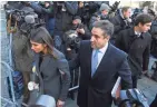  ?? ROBERT DEUTSCH/USA TODAY ?? Ex-Trump lawyer Michael Cohen walks with his daughter, Samantha, as he arrives for sentencing at a federal courthouse in New York Wednesday.