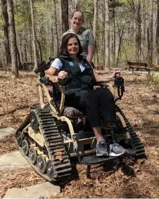  ?? — The Washington Post photos courtesy of Georgia Department of Natural Resources ?? Melanie Dunn and park ranger Leslie Mobley with the all-terrain track chair.