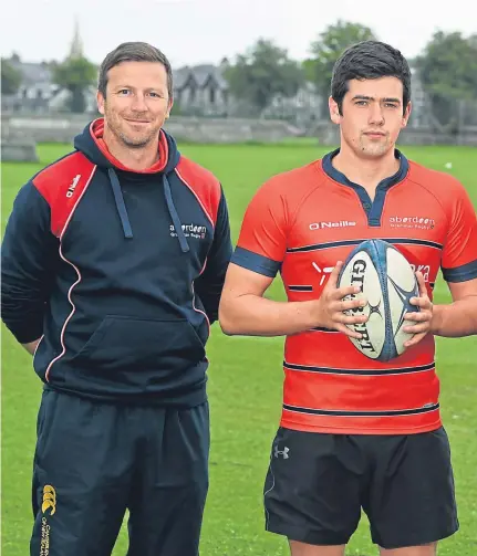  ??  ?? READY FOR ACTION: Aberdeen Grammar coach Ali O’Connor, left, with, from left, Sam Knudson, club captain