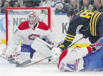  ?? JEFFREY T. BARNES/THE ASSOCIATED PRESS ?? Sabres forward Marcus Foligno is stopped by Canadiens goalie Carey Price Wednesday during the first period of the Sabres’ 2-1 victory in Buffalo. Price made 28 saves, including several on in-close attempts by Buffalo shooters.