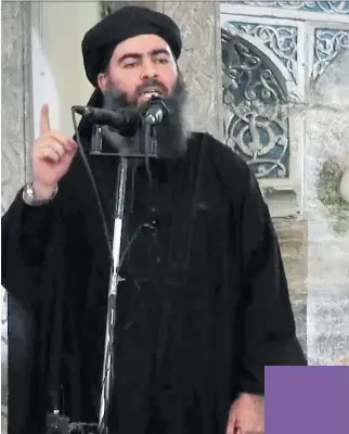  ?? MILITANT VIDEO/ THE ASSOCIATED PRESS ?? This is said to be a rare photo of the leader of the Islamic State group, Abu Bakr al-Baghdadi.