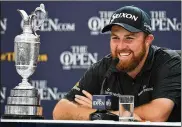  ?? STUART FRANKLIN / GETTY IMAGES ?? Champion Shane Lowry of Ireland earned his place with a 63 in the third round that broke the 54-hole scoring record at the British Open and staked him to a four-shot lead.