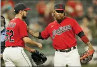  ?? TONY DEJAK — THE ASSOCIATED PRESS ?? Jose Ramirez, right, and Nick Sandlin celebrate after the Indians defeated the Reds on Aug. 9at Progressiv­e Field.