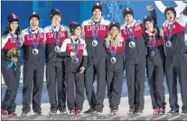  ?? CANADIAN PRESS FILE PHOTO/PAUL CHIASSON ?? In this Feb. 10, 20-14 file photo, Kaetlyn Osmond (left) poses with other members of the Canadian after receiving their silver medals for the figure skating team event at the Sochi Winter Olympics.