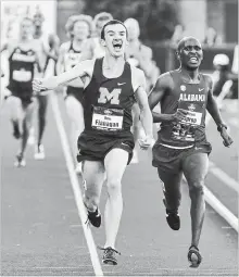  ?? ANDY NELSON THE REGISTER-GUARD VIA THE ASSOCIATED PRESS ?? The University of Michigan’s Ben Flanagan, a former track standout at St. Mary’s High School in Kitchener, begins to celebrate his NCAA title in the men’s 10,000-metre race as he passes Alabama’s Vincent Kiprop near the finish line during the first day...