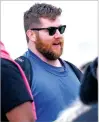  ?? REED HOFFMANN/THE ASSOCIATED PRESS ?? Chiefs guard Joe Thuney, left, talks to teammates as they wait to board a plane Sunday in Kansas City, Mo.