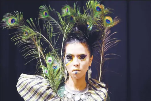  ??  ?? A model presents a creation by a Malaysian make-up artist during the Malaysian Heritage Make Up Show in Kuala Lumpur on May 6. (AFP)