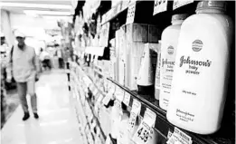  ?? FREDERIC J. BROWN/GETTY-AFP 2017 ?? J&J pulled its talc-based baby powder off the shelves in the U.S. and Canada last month.