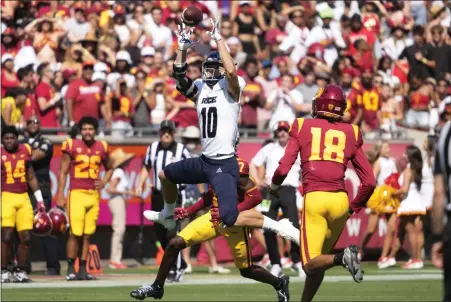  ?? PHOTO BY KEITH BIRMINGHAM — PASADENA STAR-NEWS — SCNG ?? Wide receiver Luke McCaffrey #10of the Rice Owls catches a pass for first down against thew USC Trojans in the first half of a NCAA football game at the Los Angeles Memorial Coliseum in Los Angeles on Saturday, Sept. 3, 2022.