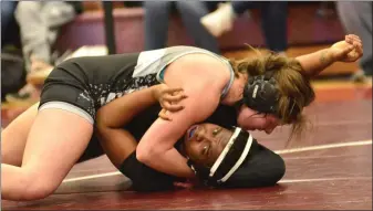  ?? BILL RUDICK - FOR MEDIANEWS GROUP ?? Strath Haven’s Hannah Spielman, top, tries to secure back points on Chichester’s Dymanique Jones in the 147-pound final at the PA girls wrestling championsh­ips on March 8. Spielman claimed an 8-2decision to win gold, among nearly 400wrestle­rs at the event hosted by Gettysburg High School that is part of a push for PIAA sanction of the sport.