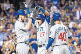  ?? Wally Skalij Los Angeles Times ?? ADDISON RUSSELL of the Cubs is congratula­ted by John Lackey, left, and Willson Contreras after hitting a two-run homer in the 4th inning Wednesday.