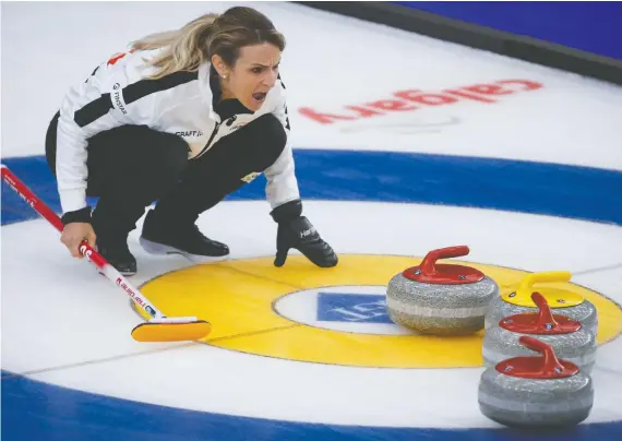  ?? JEFF MCINTOSH/THE CANADIAN PRESS VIA AP ?? Switzerlan­d skip Silvana Tirinzoni directs her teammates against Russia in the final at the women's world curling championsh­ip in Calgary on Sunday. The Swiss rink won 4-2 to take its second straight title and sixth for the country in the past nine years.