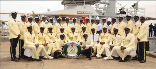  ??  ?? Commanding Officer NNS EKULU, Commander Andrew Zidon, flanked by officers and men