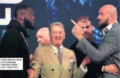 ??  ?? Frank Warren steps in to separate Deontay Wilder and Tyson Fury