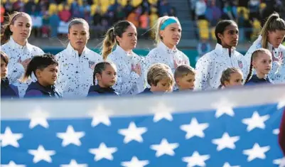  ?? JOHN COWPLAND/AP ?? U.S. team sing their national anthem ahead of play in the Women’s World Cup Group E match against Netherland­s in Wellington, New Zealand, Thursday.