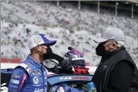  ?? BRYNN ANDERSON — THE ASSOCIATED PRESS ?? NASCAR Cup Series driver Kyle Larson, left, talks to the owner of the team Hendrick Motorsport­s, Rick Hendrick, right, before a race at Atlanta Motor Speedway on Sunday in Hampton, Ga.