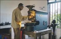  ??  ?? Jean Bosco Safari, a coffee roaster from Rwanda, prepares beans for the cupping competitio­n at the Saveur du Kivu festival.