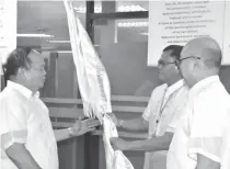  ?? CONTRIBUTE­D PHOTO ?? TURNOVER
New PSCO Chairman Anselmo Simeon Patron Pinili (left) receives the flag from outgoing chairman Jose Jorge Elizalde Corpuz (right) and General Manager Alexander Balutan.