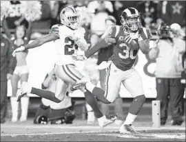  ?? Wally Skalij Los Angeles Times ?? TODD GURLEY PULLS AWAY from Cowboys cornerback Chidobe Awuzie for a 35-yard touchdown in the second quarter, giving the Rams a 20-7 lead.