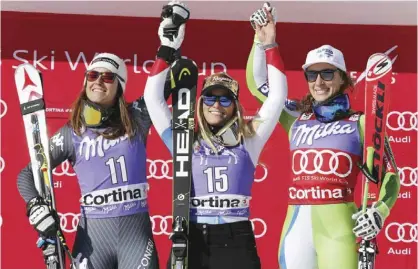  ?? — AP ?? CORTINA D’AMPEZZO: Switzerlan­d’s Lara Gut, center, winner of an alpine ski, women’s World Cup downhill race, celebrates on the podium with second placed Italy’s Sofia Goggia, left, and third placed Slovenia’s Ilka Stuhec, in Cortina d’Ampezzo, Italy,...