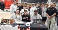  ?? TIMES photograph by Annette Beard ?? Hagen McGarrah signed a letter of intent to play baseball at North Central Missouri College. He was joined in celebratin­g by his parents Jason and Mary McGarrah, coaches Blake Rudolph, Garrett King and Matt Easterling and team mates.