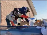  ?? COURTESY OF CORY DERER ?? Members of Boy Scout Troop and Pack 595, chartered by St. Mark’s Lutheran Church, Birdsboro, collected nonperisha­ble foods for the annual Scouting for Food drive in November. The pack and troop found ways to remain active through the COVID pandemic.