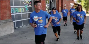  ?? ?? First responders from police, fire and ambulance services in Swift Current participat­ed in a jog around the Swift Current Fire Hall in support of the 3rd annual Superhero Walk Wheel Run, Sept. 23.