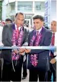  ??  ?? MBSL Chairman Dr. Sujeewa Lokuhewa and Chief Executive Officer Nishaman Karunapala open the remodeled Gampaha branch