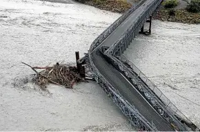  ?? GEORGE HEARD/STUFF ?? The flood that took out the Waiho River bridge near Franz Josef in March 2019 was caused by an atmospheri­c river.