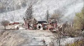  ?? Kirk McKoy Los Angeles Times ?? A RESIDENCE on Little Tujunga Canyon Road was among at least 18 structures destroyed by the Sand fire. It has burned more than 35,000 acres.