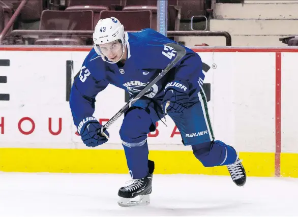  ?? RICHARD LAM ?? Prospect Quinn Hughes takes to the ice for the first time in a Canucks jersey Tuesday during the team’s developmen­t camp. He showed off a quick stride and blazing speed.