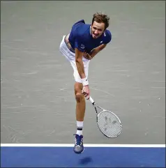  ?? BEN SOLOMON/THE NEW YORK TIMES ?? Daniil Medvedev follows through on a smash Friday against Felix Augeralias­sime at Arthur Ashe Stadium in New York. Medvedev advanced to the final, where he will play the winner of Friday night’s match between No. 1 Novak Djokovic and No. 4 Alexander Zverev.