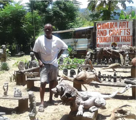  ??  ?? David Chimuka in front of his artefacts