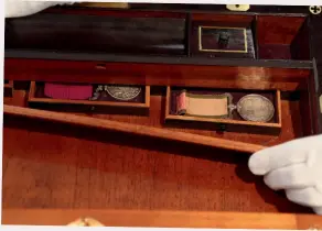  ?? ?? The medals were concealed within a hidden compartmen­t in the desk