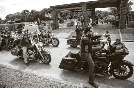  ?? Photos by Brett Coomer / Staff photograph­er ?? Members of the U.S. Marines Veterans Motorcycle Club salute veteran James Virgil Davis during his funeral Saturday at Angleton Cemetery. Davis died April 27 at age 89 in an assisted-living facility after surviving COVID-19 and returning from the hospital.