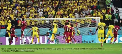  ?? Shaji Kayamkulam ?? Qatar and Ecuador players in action during their FIFA World Cup Qatar 2022 Group A match at Al Bayt Stadium in Al Khor yesterday. PICTURE: