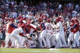  ?? AP photo ?? Benches clear during the eighth inning of a game between the Cardinals and Mets on Wednesday in St. Louis.