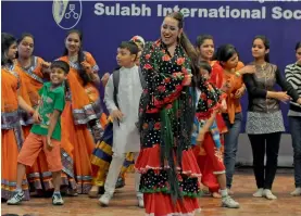  ?? — BIPLAB BANERJEE ?? Spanish singer and actor Maria Del Mar Fernandez performs during a Swachchh Bharat campaign in New Delhi on Tuesday.