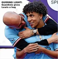  ?? ?? GUIDING LIGHT: Guardiola gives Lewis a hug