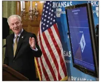  ?? (Arkansas Democrat-Gazette/John Sykes Jr.) ?? Gov. Asa Hutchinson discusses the imminent reopening of state parks and retail businesses during his daily briefing, held Friday at the governor’s conference room at the Capitol in Little Rock. More photos at arkansason­line.com/516covbrie­f/.