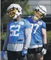  ?? Gary Coronado Los Angeles Times ?? KHALIL MACK, left, and Joey Bosa have pushed each other on and off the field.