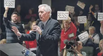  ?? Randall Benton Sacramento Bee ?? REP. TOM MCCLINTOCK (R-Elk Grove) faces an angry crowd at a town hall last weekend. He was one of several Republican lawmakers who faced tough questions from people opposed to President Trump’s agenda.