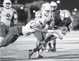  ?? DANIEL A. VARELA dvarela@miamiheral­d.com ?? Central quarterbac­k Keyone Jenkins dives for a touchdown against Palmetto in the Class 6A state semifinal Friday night at Traz Powell Stadium. Jenkins also threw for five TDs.