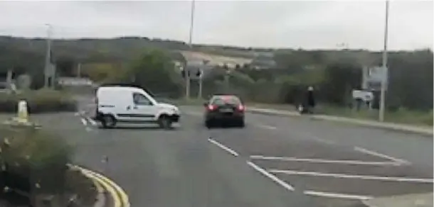  ??  ?? EVASIVE ACTION: A still from the video shows the car swerving as the white van edges into the road, a woman pushing a buggy can be seen on the right